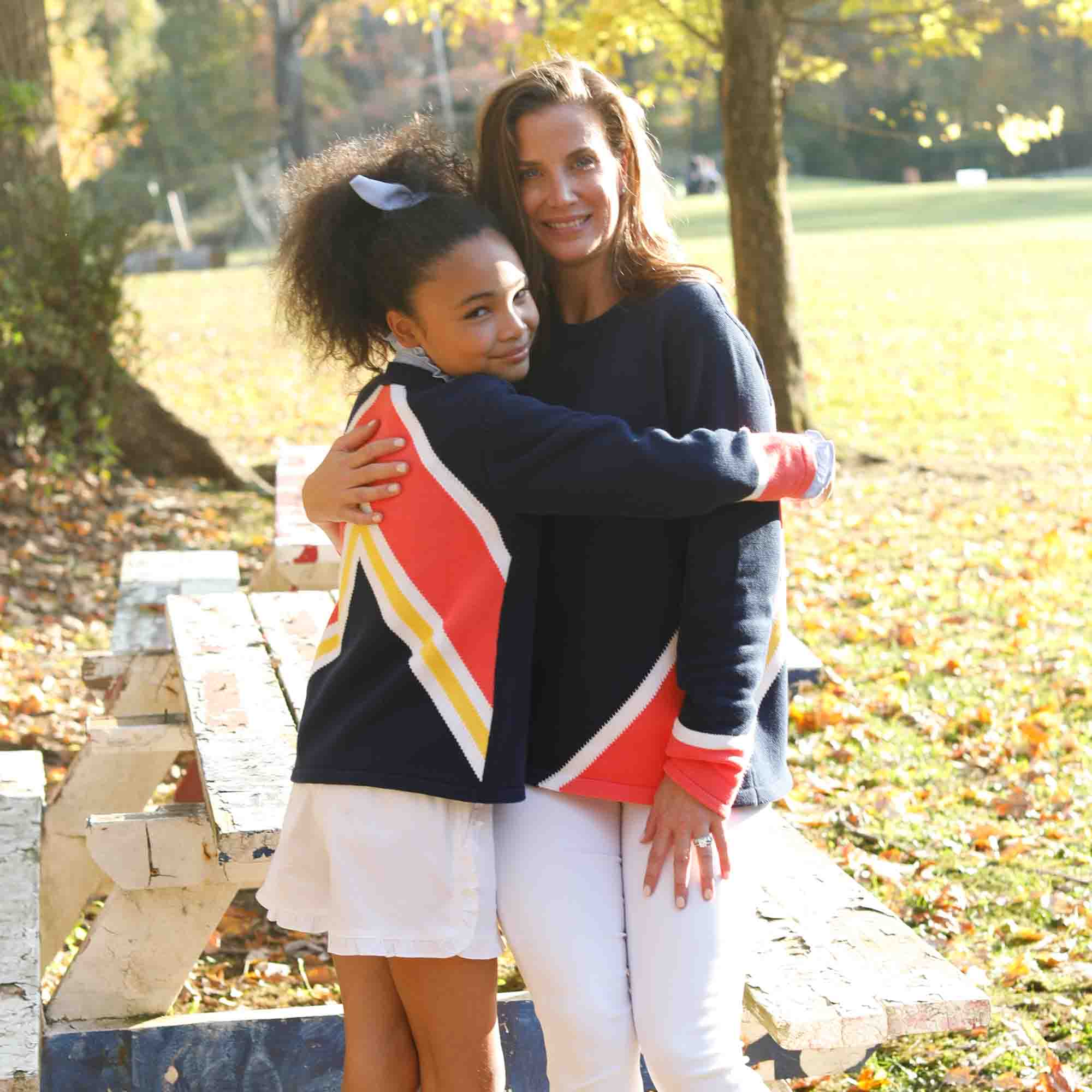 mother and daughter wearing cute matching classic prep retro sweaters