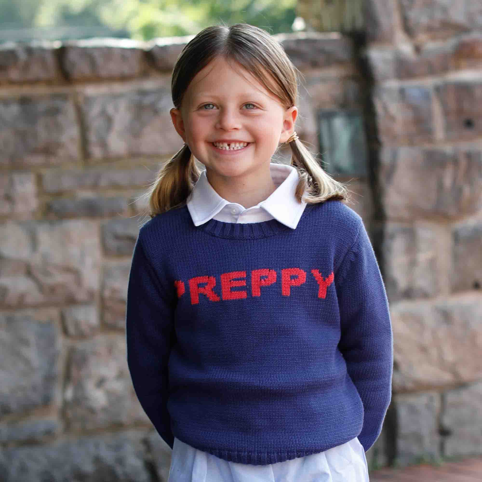 girl wearing preppy sweater