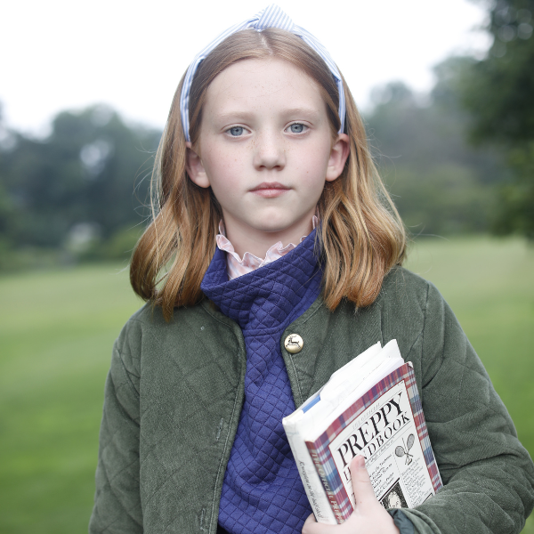 Girl holding book wearing Gracie Jacket, Wren Pullover, Ginny Buttondown, and Knot Headband